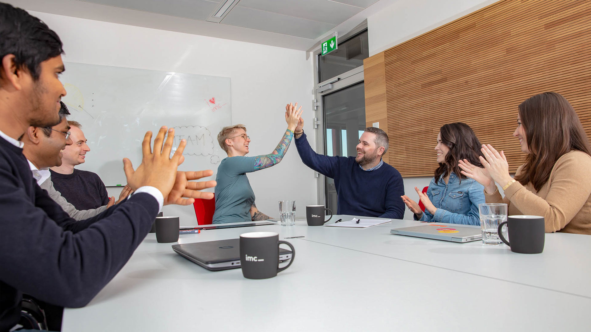 team celebrating with a high five