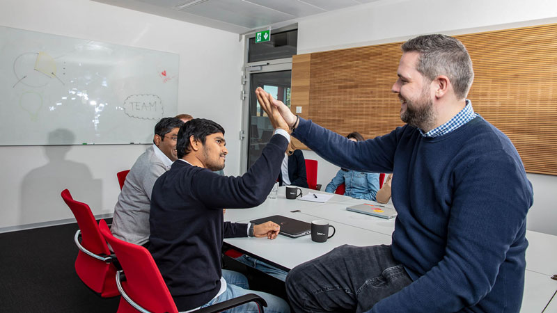 imc bid manager in action high fiving