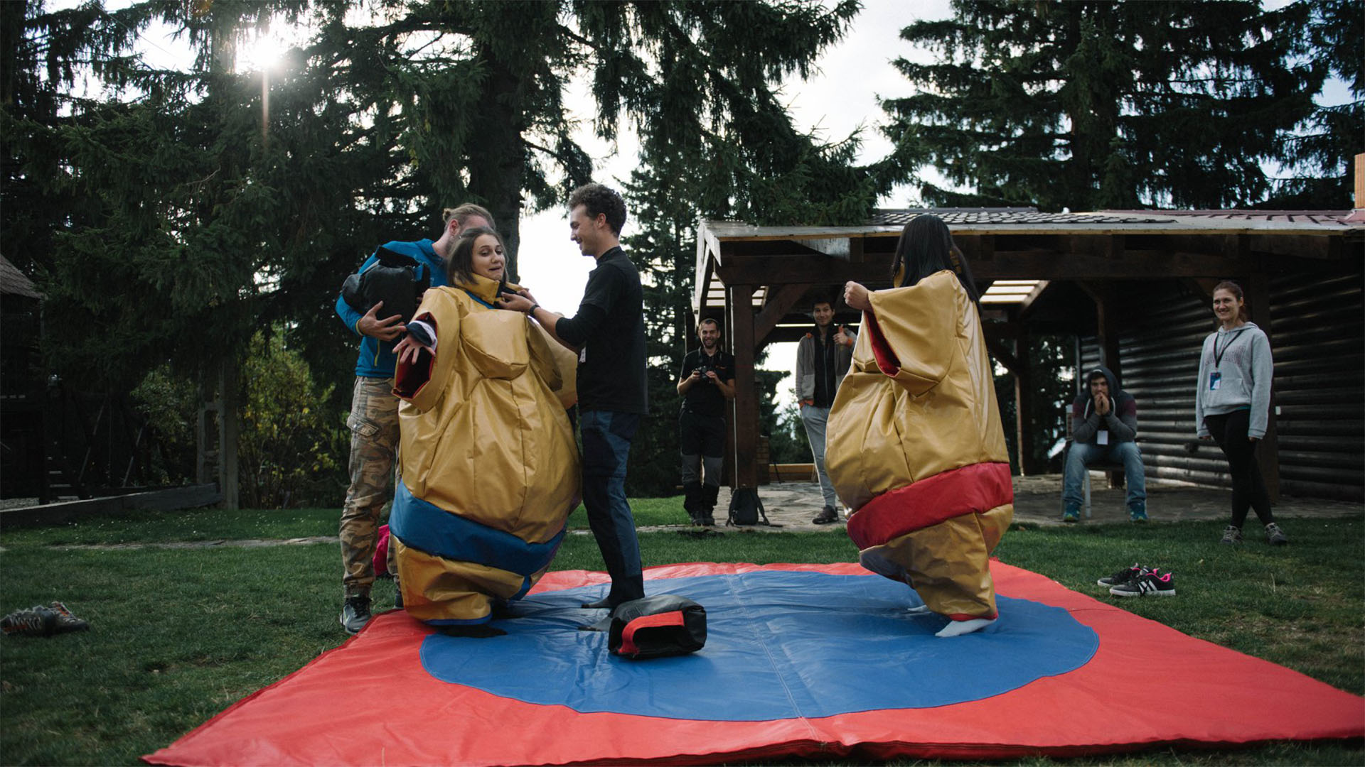 imc employees in sumo suits
