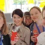 imc employees smiling at camera