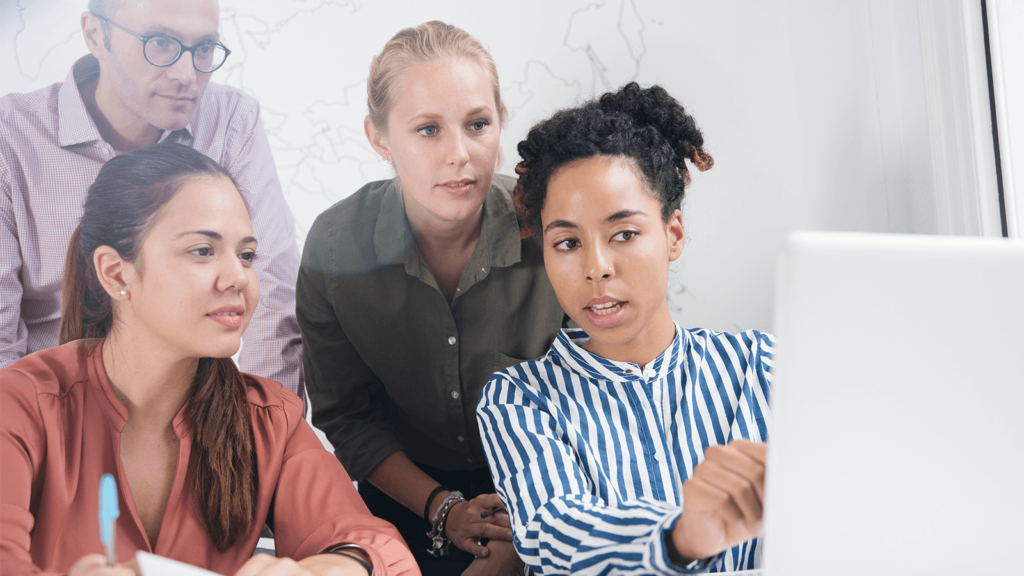 employees discussing things on computer