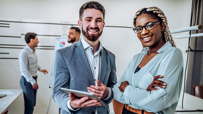 colleagues gathered around computer