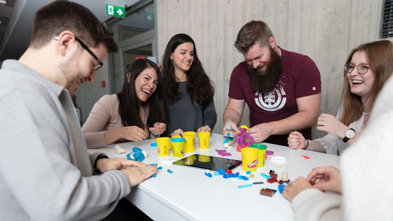 imc employees playing with playdough
