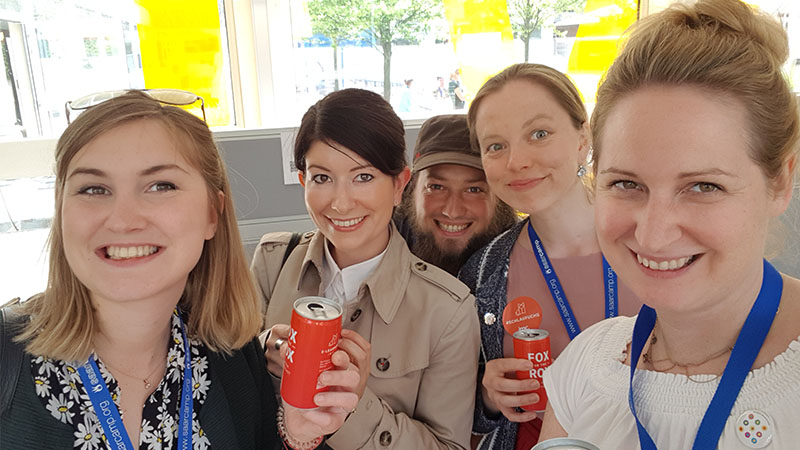 imc employees smiling at camera