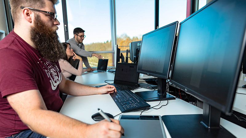 media designer working on designs