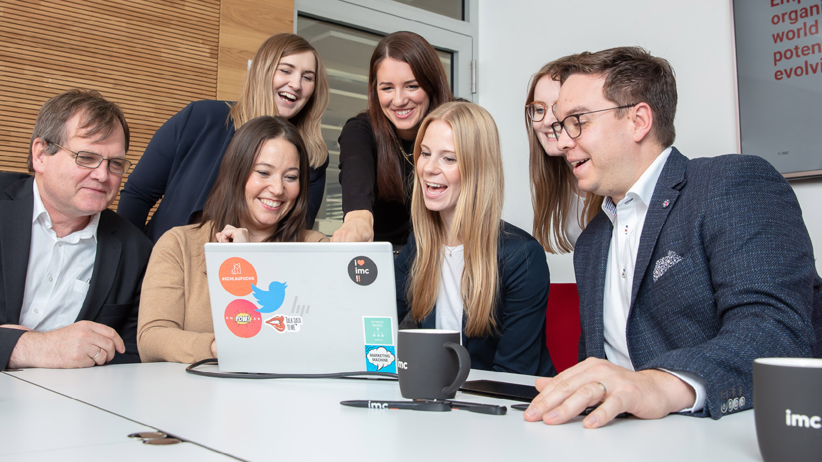 Photo of imc workers watching a screen