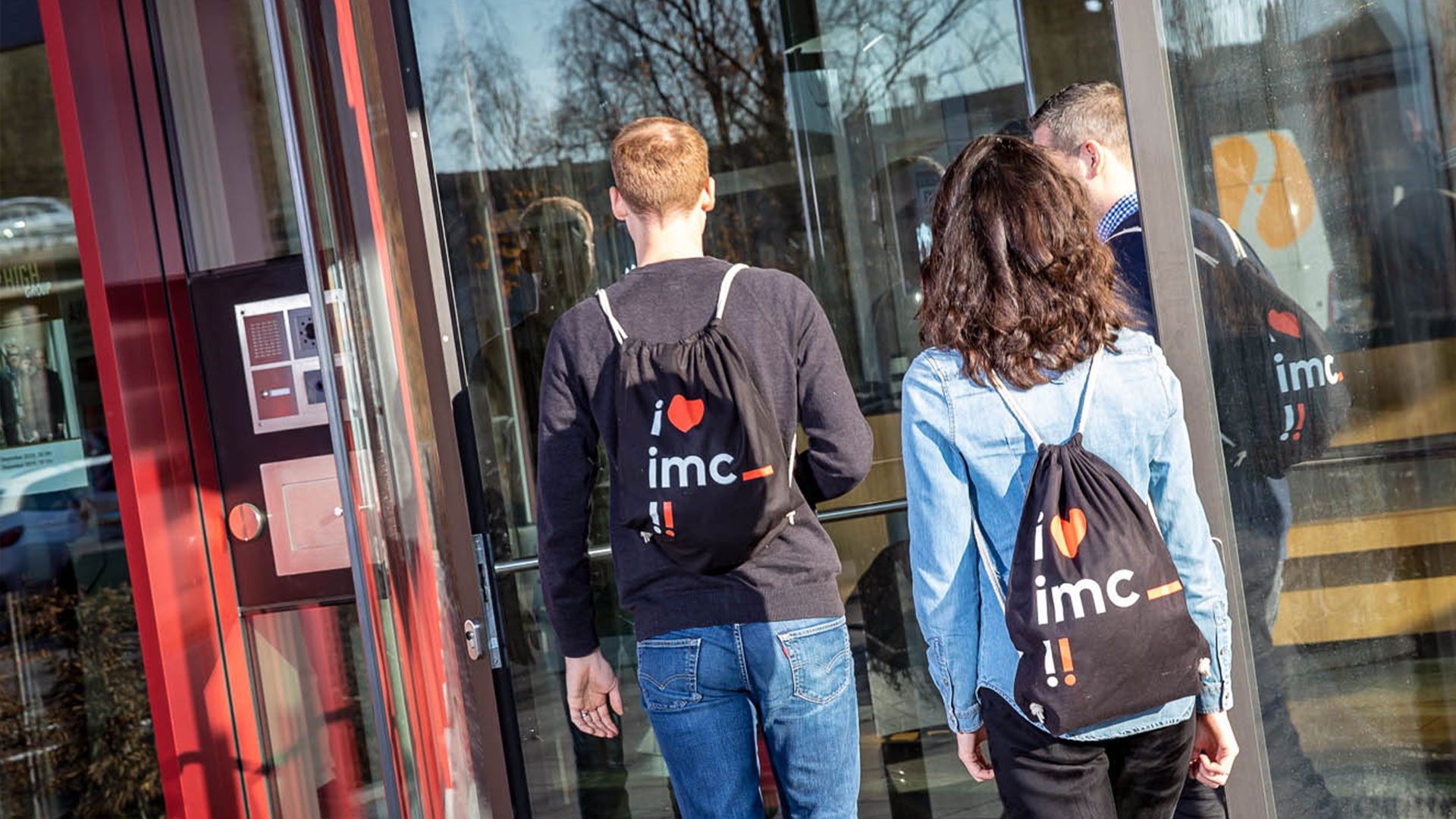 image of new employees entering imc office tower