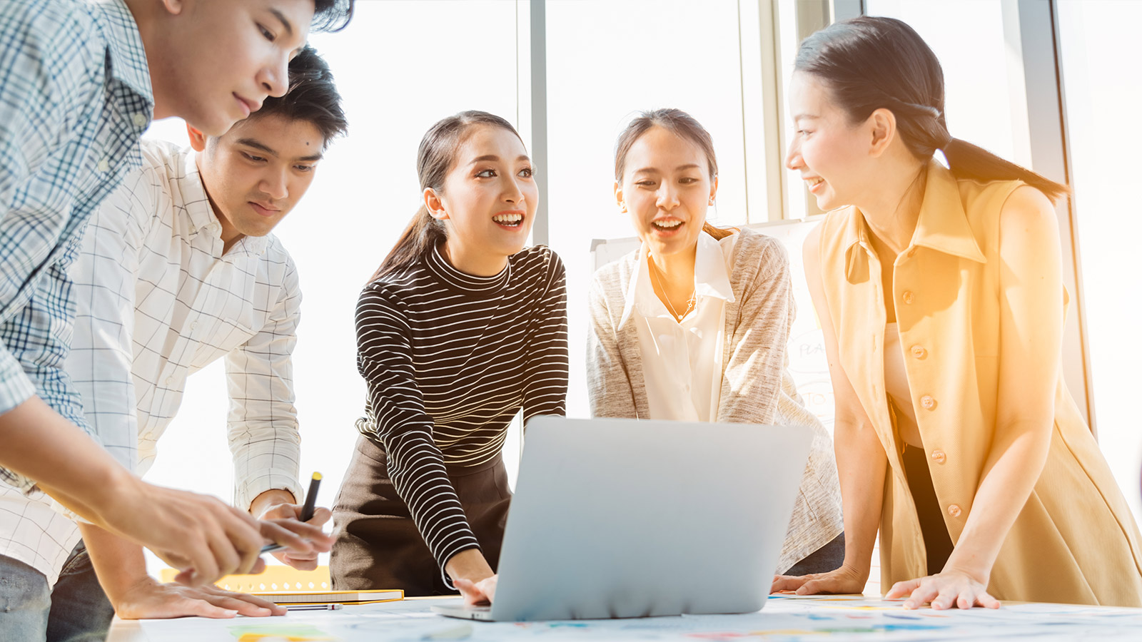 colleagues cellebrating Digital Learning Transformation