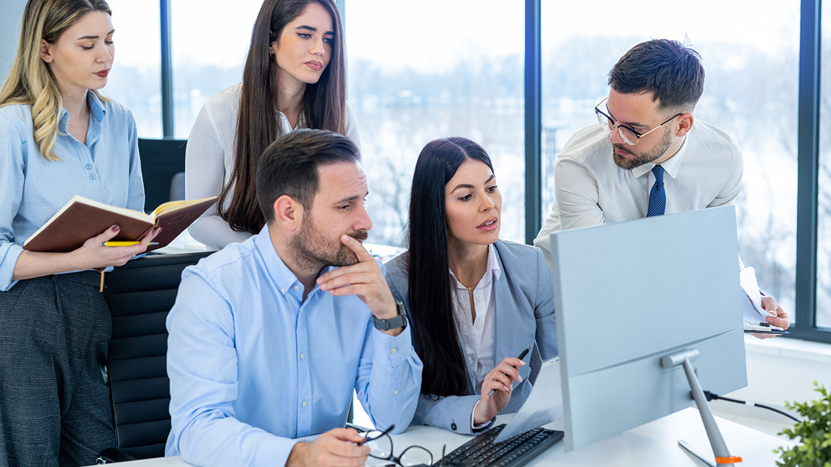 colleagues discussing LMS