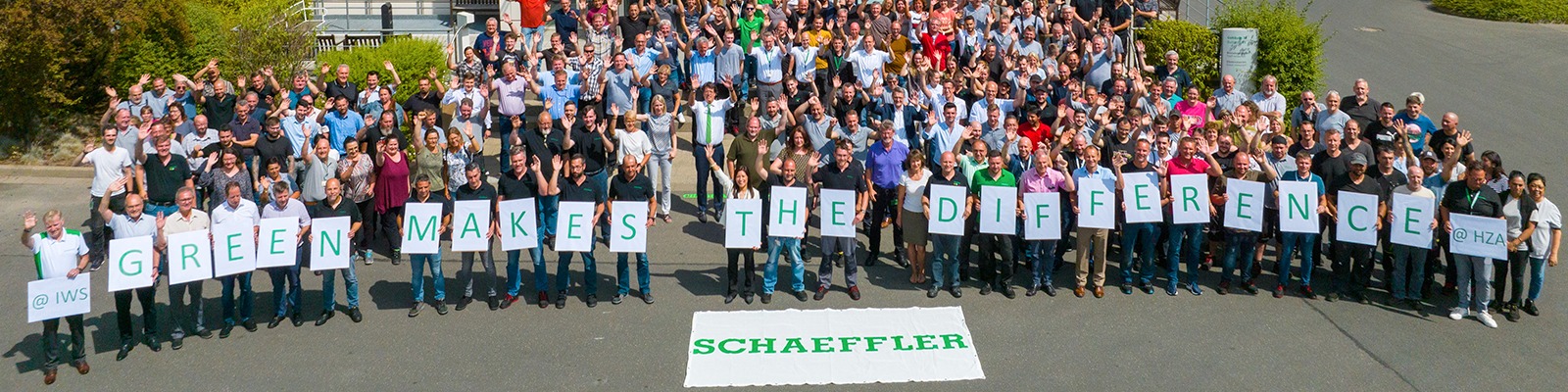 Schaeffler Employees holding up signs
