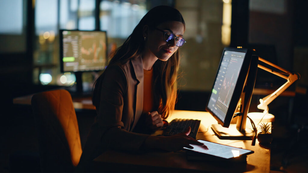Person working at their desk later at night